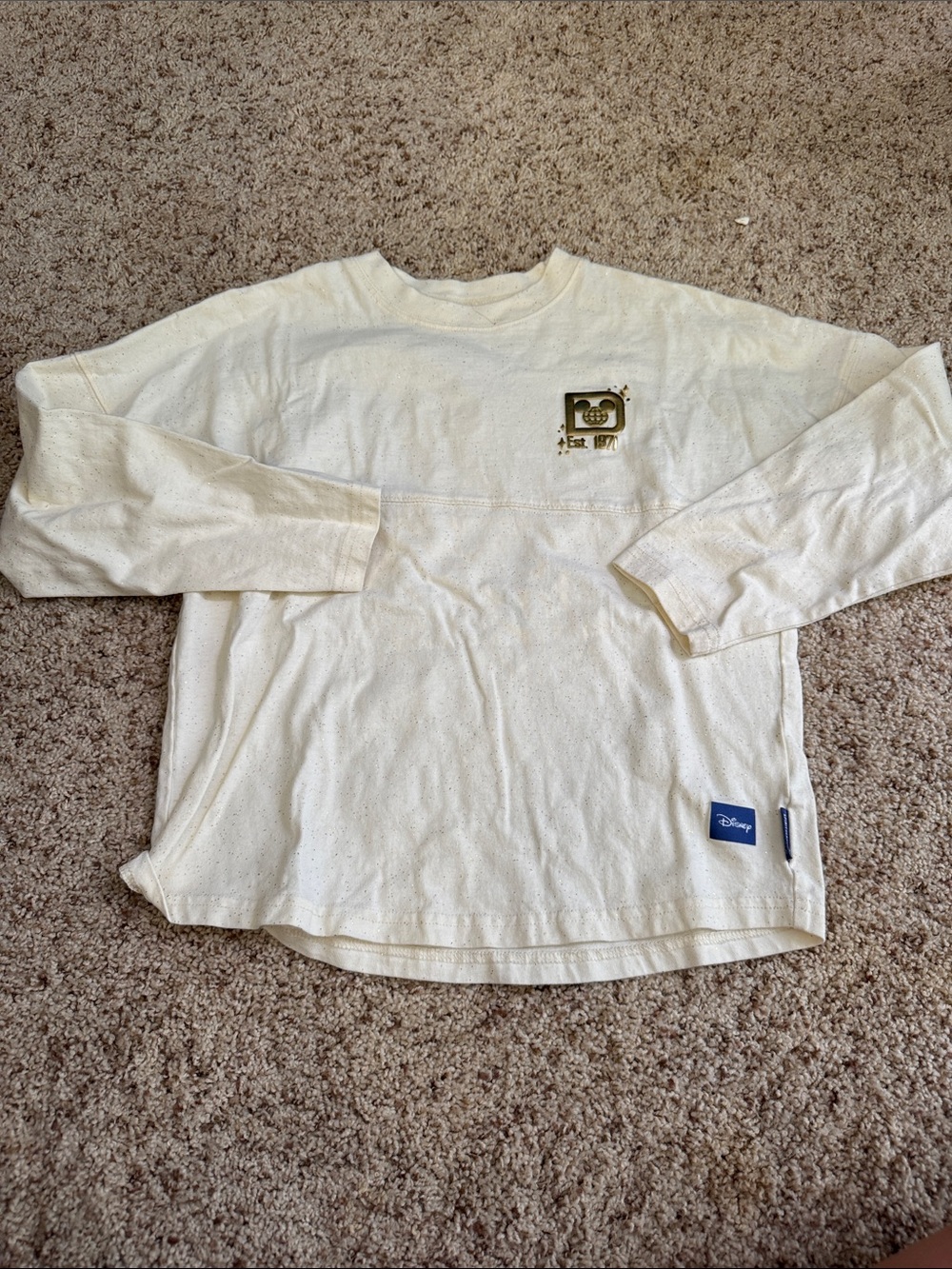 Disney Spirit Jersey
Cream Long Sleeve Top with Small Gold Graphic